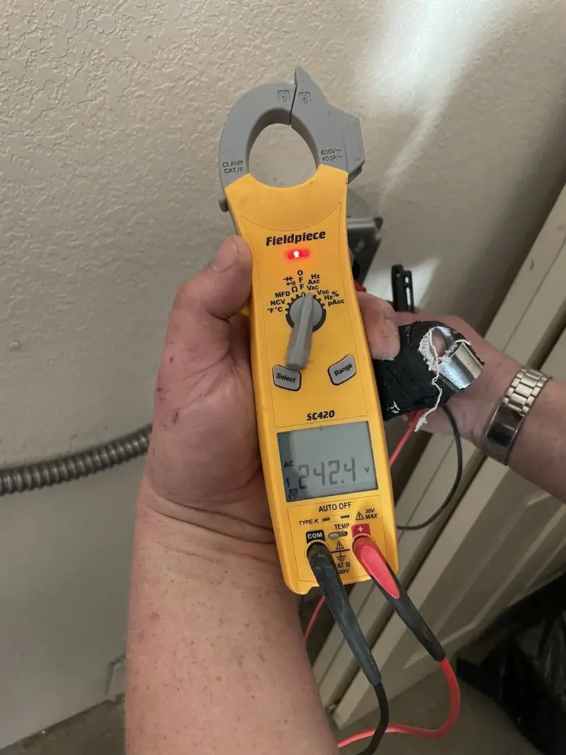 Voltage testing with clamp meter during Ceiling Fan Installation in Dover